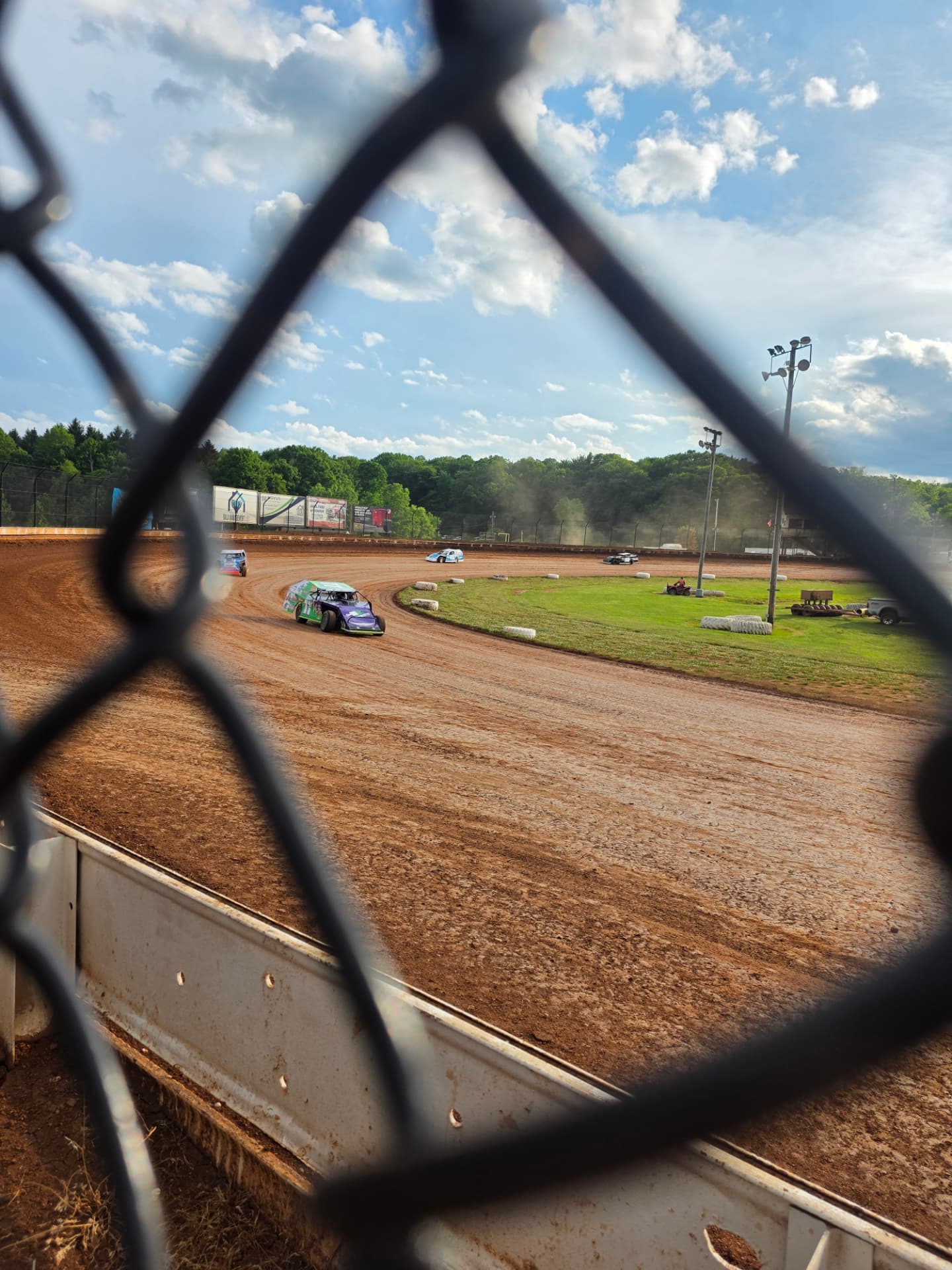 Ryan Johnston #11 EconoMod running the dirt oval seen from the grandstands