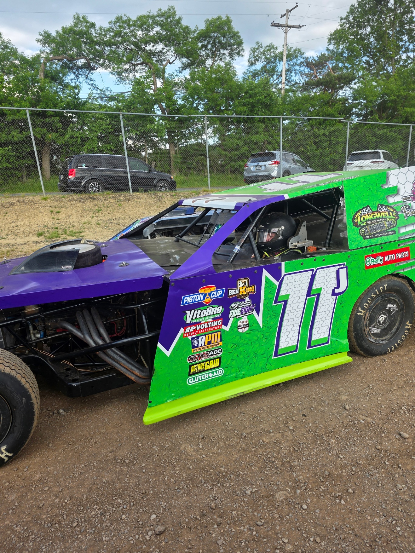 Ryan Johnston #11 EconoMod side profile showing sponsor wrap in the pits 2026