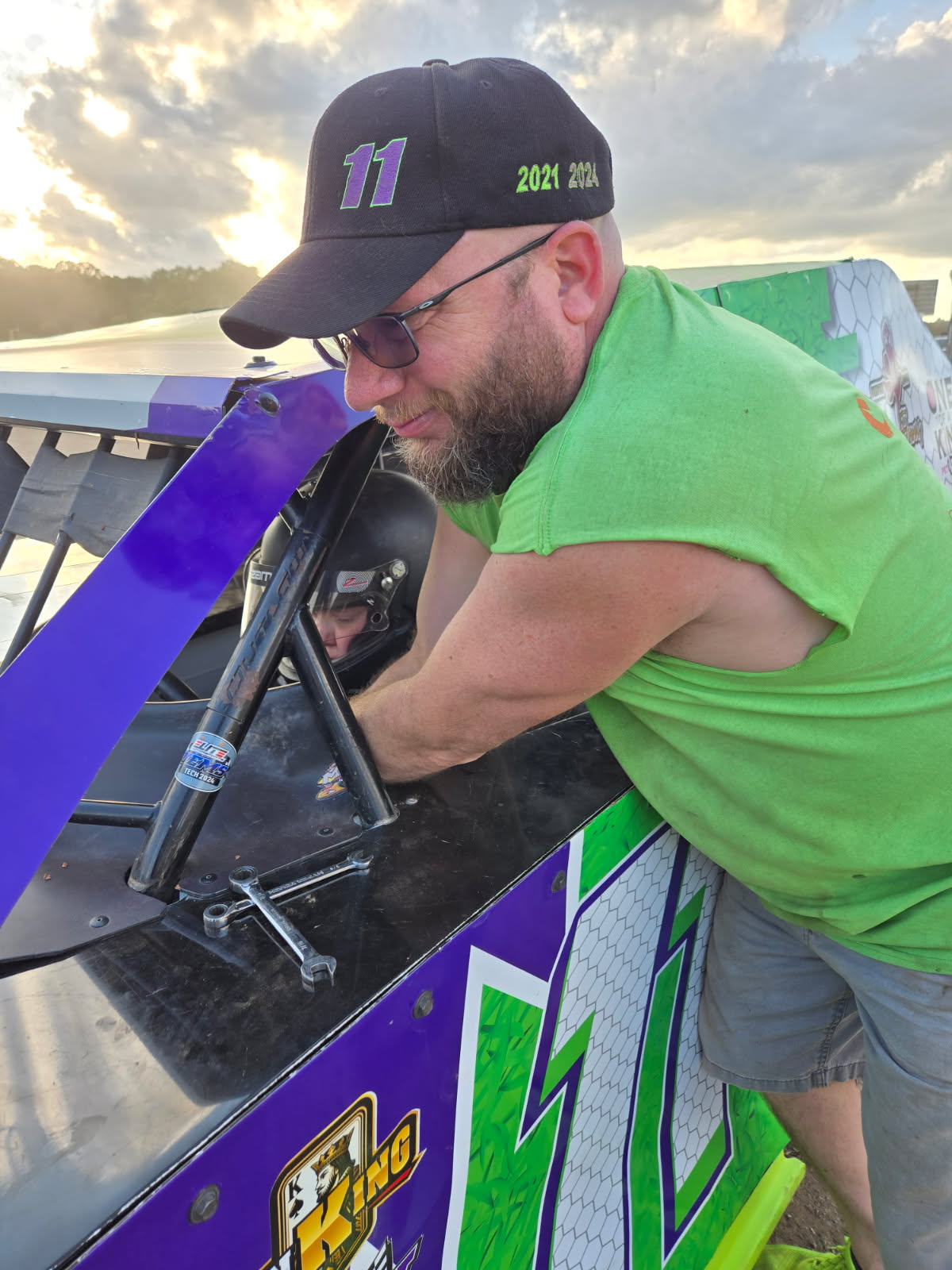 Crew chief making final adjustments to the #11 EconoMod before a 2026 race