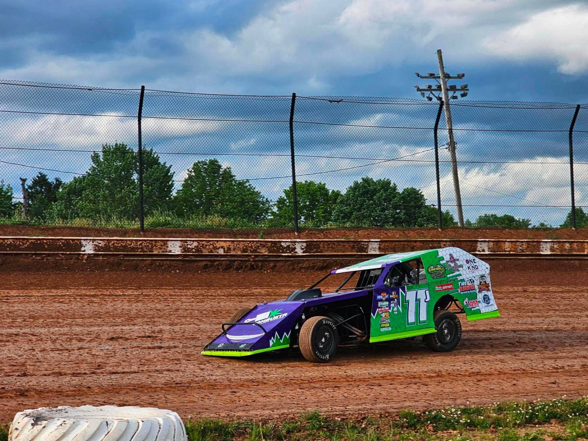 Purple and green #11 EconoMod race car on dirt track β R & R Racing
