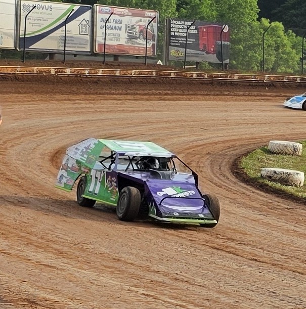 Ryan Johnston #11 EconoMod sliding through corner at Sharon Speedway dirt track 2026