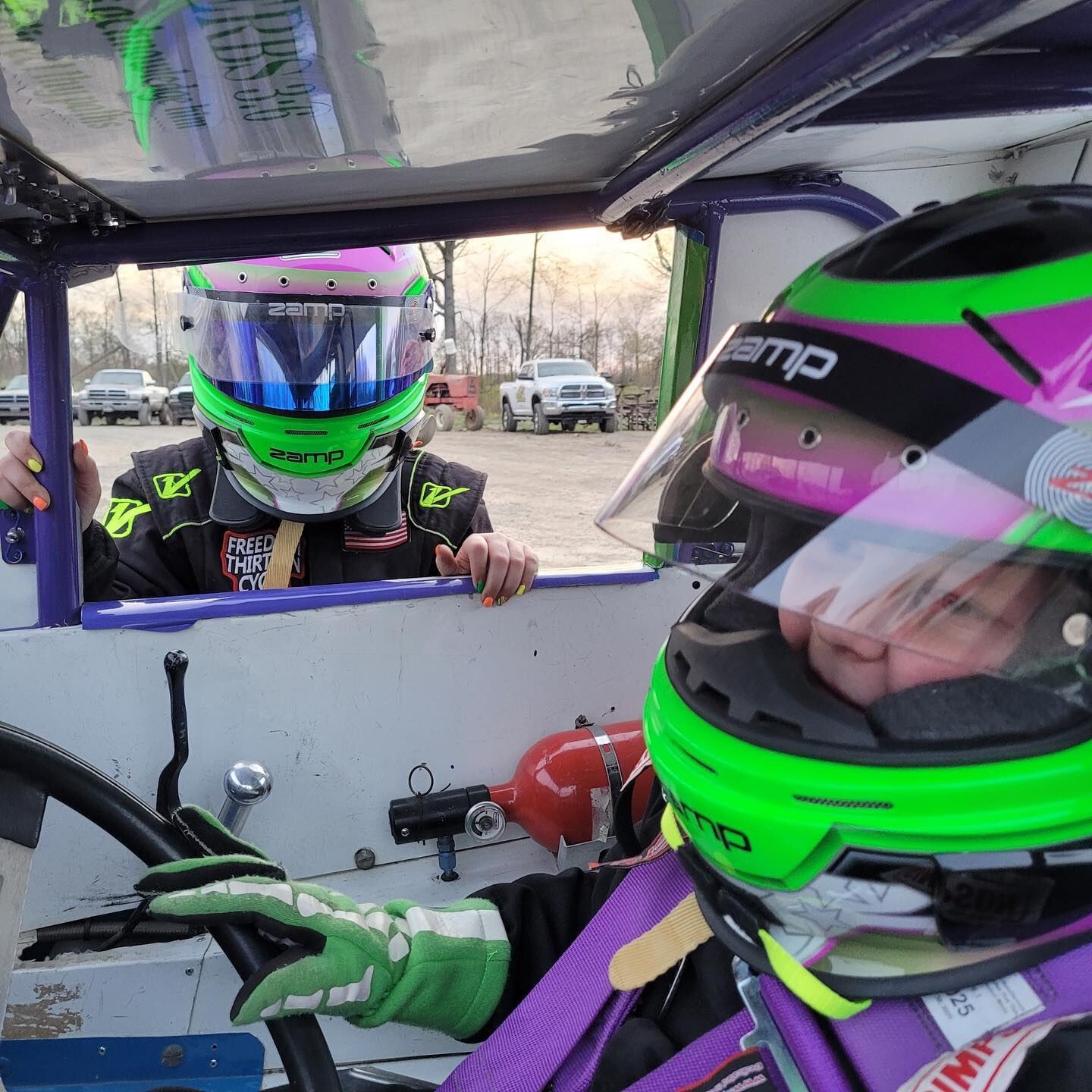 Ryan Johnston in helmet and racing gear inside EconoMod cockpit