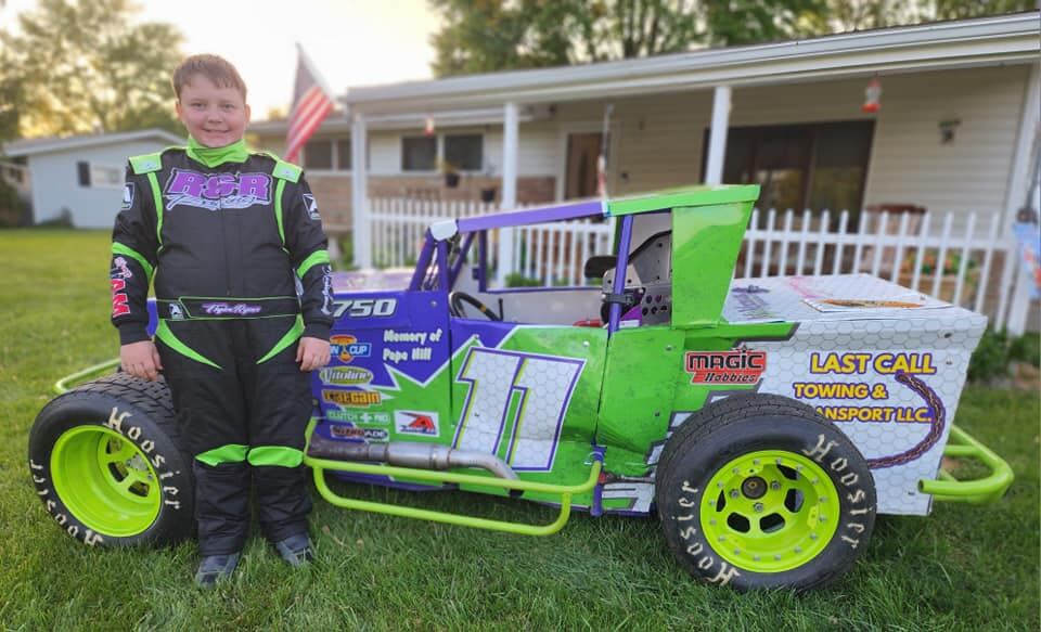 Ryan Johnston posing with #11 EconoMod showing sponsor decals
