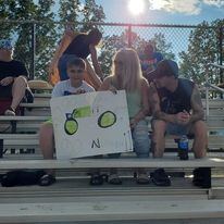 R&R Racing fans holding handmade sign in grandstands at Ohio dirt track